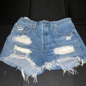 Levi’s Denim Jean Shorts, distressed. Size W27.